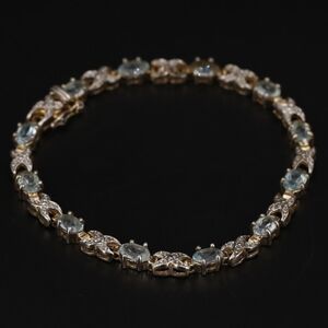 Blue Topaz & Diamond Gold Tennis Bracelet